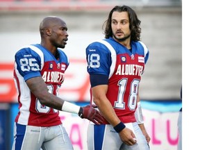 Alouettes receiver Chad Johnson, left, walks with quarterback Jonathan Crompton during warm-up prior to Canadian Football League game against the Ottawa Redblacks in Montreal Friday August 29, 2014.