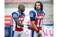Alouettes receiver Chad Johnson, left, walks with quarterback Jonathan Crompton during warm-up prior to Canadian Football League game against the Ottawa Redblacks in Montreal Friday August 29, 2014.