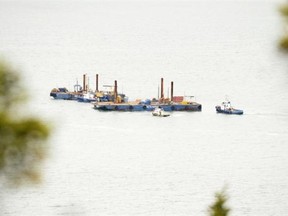 Two barges conduct seismic tests in the St. Lawrence River, off Cacouna, September 23, 2014, before the building of  an oil terminal for TransCanada that would start operating in 2018.
