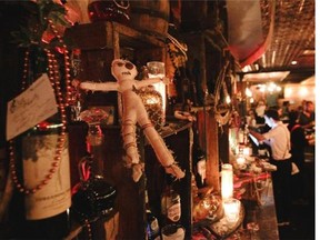 Behind the counter at Baron Samedi on Masson St. The New Orleans-themed bar has a voodoo-Haitian feel.