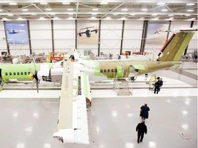 Bombardier Aerospace employees assemble a Q400 airliner at the Bombardier aircraft manufacturing facility in Toronto.