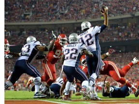 Tom Brady #12 of the New England Patriots passes against the Kansas City Chiefs  at Arrowhead Stadium on September 29, 2014 in Kansas City, Missouri.  (Photo by Peter Aiken/Getty Images)