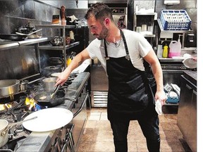 Chef Sean Murray Smith in the kitchen of Les deux singes de Montarvie in Mile End. TripAdvisor ranks the bistro the No. 1 restaurant in Montreal.