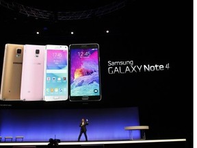 D.J. Lee, executive vice-president of electronics giant Samsung, presents a new version of the company's giant-sized smartphone, the Galaxy Note 4, on Sept. 3, 2014 in Berlin, in advance of the consumer electronics trade fair Internationale Funk Ausstellung. IFA, one of Europe's biggest showcases of the latest electronic gadgets, is scheduled to open on Sept. 5 and run until Sept. 10, 2014.