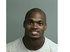 This photo provided by the Montgomery County sheriff’s office shows the booking photo of Adrian Peterson. Peterson was indicted in Texas for using a branch to spank one of his sons and the Minnesota Vikings promptly benched him for their game Sunday, Sept. 14, against the New England Patriots. Peterson turned himself in early Saturday at a jail in Montgomery County, near Houston, where he has a home. He was processed and released.