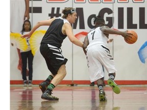 Win Butler, left, participates in a POP vs. Jock basketball game at the McGill University Sports Centre in Montreal on Saturday as part if the Pop Montreal Festival.
