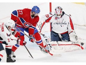 Canadiens’ Alex Galchenyuk looks for rebound as Capitals goalie Braden Holtby makes a save during a pre-season game in Montreal on Sunday, September 28, 2014.