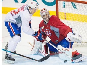Canadiens goalie Carey Price makes a save against forward Patrick Holland during a team scrimmage at the Bell Sports Complex in Brossard on Sunday.