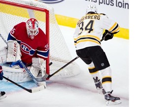 Canadiens goalie Dustin Tokarski stops Bruins centre Carl Soderberg during first-period pre-season National Hockey League action Tuesday, Sept. 23, 2014, in Montreal.