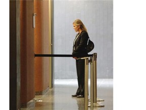 Caroline Simoneau, who was a crime scene photographer where remains of Lin Jun were found, at the Montreal courthouse Monday, September 29, 2014 waits to be summoned for her testimony  in the afternoon session of the trial of Luka Magnotta who is accused of killing  Lin Jun. Magnotta’s first-degree murder trial got underway at the Montreal courthouse.  Simoneau is the first witness of the trial.