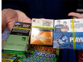 Cigarette packaging with warning labels. (GEOFF ROBINS/AFP/Getty Images)