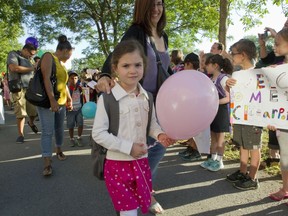 Four-year-old Claudia del Amo walks with her mother, Monica Matas.