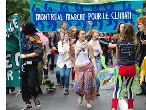 Climate activists march along Ave du Parc la Fontaine as thousands of people take part in the People’s Climate March in Montreal on Sunday Sept. 21, 2014. Similar marches are being held around the world ahead of the the climate summit in NYC held by UN secretary general Ban Ki-moon.