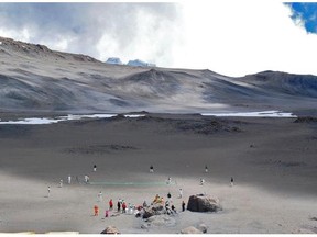 Cricketers play on September 26, 2014 on the ice-covered crater of the Kilimanjaro mountain, Tanzania . The game is an attempt to play the world's highest game of cricket, breaking the previous record set in 2009 on Mount Everest. The attempt comes after a gruelling eight-day trek up the vast extinct volcano, to play a full Twenty 20 game on crater just below its rugged peak at 5,7895 meters (19,000 feet).