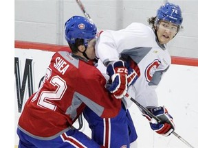 Defenceman Bobby Shea gets an elbow in the face from forward Tyler Hill during a scrimmage on the last day of the Canadiens’ rookie camp at the team’s practice facility in Brossard on Tuesday, Sept. 16, 2014.