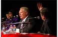 Doug Ford, centre, is pushed to answer a question as whether he will march in annual Pride parade by fellow candidates John Tory, right, and Olivia Chow as he takes part in a Toronto Mayoral Debate in Toronto on Tuesday, September 23, 2014. THE CANADIAN PRESS/Chris Young