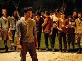 Dylan O’Brien (front) stars in “The Maze Runner.”