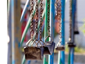 Empty swings in a playground. (Allen McInnis / THE GAZETTE)  ORG XMIT: 50