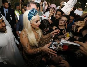 Lady Gaga dressed demurely — relatively speaking — for her arrival in Dubai on Monday.