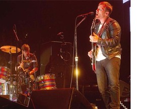 Black Keys singer Dan Auerbach and Patrick Carney, on drums in backround, during their performance at the Bell centre on Sept. 18, 2014..Pierre Obendrauf / THE GAZETTE