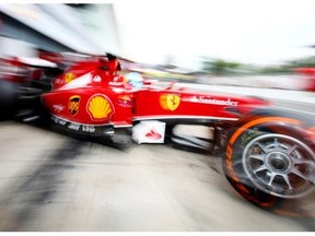 Fernando Alonso of Spain and Ferrari drives during Practice ahead of the F1 Grand Prix of Italy at Autodromo di Monza.