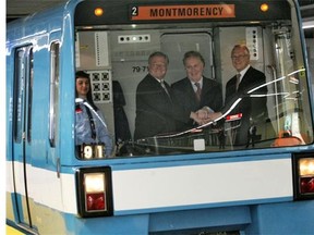 Former premier Jean Charest is flanked by ex-mayors Gilles Vaillancourt (Laval), left, and Gérald Tremblay (Montreal) at the launch of the Montmorency métro station in Laval in 2007. MARIE-FRANCE COALLIER/GAZETTE files