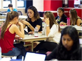 From the left: Alessia Ferrara, Nicole Kardamakis and Anthoula Mantis in the Vanier College cafeteria in the St-Laurent area of Montreal Wednesday, September 10, 2014. Vanier is the first CEGEP in the province to ban both fried foods and soft drinks. It is also launched Jake’s Café the new co-op cafeteria  to be run by students, all in an effort to promote healthier eating.