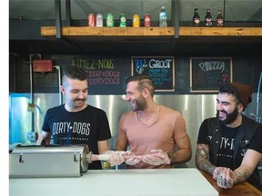 From left, Dave Lee, operations manager, Billy Kontos, president, and Alexander Levi, general manager, of Dirty Dogs, share a laugh.