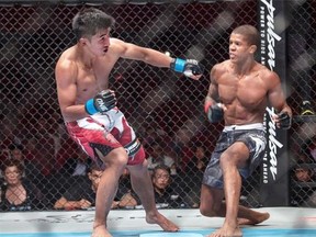 Geje Eustaquio (left) competes against Adriano Moraes (right) for the Flyweight World Championship during One FC Cambodia on September 12, 2014 in Phnom Penh, Cambodia.