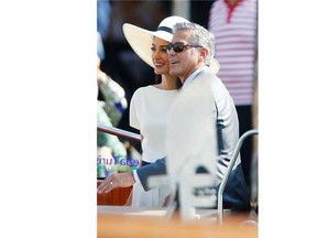 George Clooney and his wife Amal Alamuddin leave the city hall after their civil marriage ceremony in Venice, Italy, on Monday, Sept. 29, 2014. George Clooney married human rights lawyer Amal Alamuddin Saturday, the actor’s representative said, out of sight of pursuing paparazzi and adoring crowds.