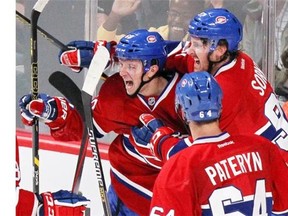 Habs celebrate after scoring on the Boston Bruins during National Hockey League pre-season game in Montreal, Tuesday, Sept, 23, 2014.