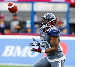 “It’s hard to dial up calls for each and every one of us, (but) we have to find a way,” says Alouettes tailback/kick-returner Tyrell Sutton,  catching a punt from Tiger-Cats kicker Justin Medlock in Montreal on Sept. 7, 2014.  (John Mahoney  / THE GAZETTE)