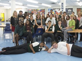 Author Monique Polak (centre wearing necklace) surrounded by Riverdale students with teacher Karen Scott (back row left) and librarian Susan Strano (back row right). Student Hamza Bashir is seated third from right.