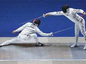 Jung Jinsun and Park Kyoungdoo of South Korea compete in the Men's Epee Final during day one of the 2014 Asian Games at Goyang Gymnasium on September 20, 2014 in Incheon, South Korea.