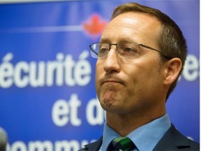 Justice Minister Peter Mackay pauses during a media availability before a roundtable discussion on justice in Vancouver, B.C., on Tuesday August 19, 2014.