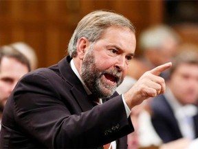 NDP Leader Tom Mulcair stands to ask a question in the House of Commons during Question Period on September 24.