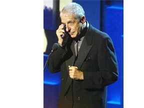 Leonard Cohen wipes away tears as he is inducted into the Canadian Songwriters Hall of Fame in 2006.