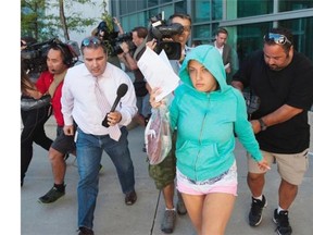 Lilia Ratmanski, 25, is released on bail at the Brampton, Ont., courthouse on Thursday, Aug. 28, 2014. A fight between two women who were allegedly drinking and smoking and making threats against the aircraft prompted a Cuba-bound Sunwing flight to turn back to Toronto on Aug 27. Aaron Vincent Elkaim THE CANADIAN PRESS