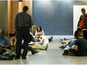 Lineup outside the courtroom at the Montreal courthouse, Monday, Sept. 29, 2014, for the start of the murder trial of Luka Magnotta.