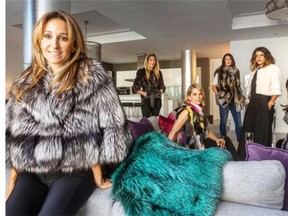Local entrepreneur Lysa Lash, left, has stayed true to the family business but with a twist: she sells the furs she designs herself at “pop-up shows” in luxury hotels. Left to right, in the background: Nathalie Andrade, Jodi Tessler, Rachel Gilmore, Mandy Majdell and Lisa Singer wear some of Lash’s creations in a model suite in The Residences at the Ritz-Carlton.