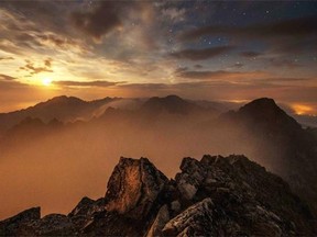 A long time exposed picture taken by night shows Slovakia's High Tatras mountains seen from the Solar observatory station on the Lomnicky Stit peak, on September 04, 2014. The coronal station at Lomnicky Stit observatory, built at 2 632 meters between 1957 and 1962, ranks among five existing stations worldwide which systematically observe emission spectral lines of the corona.