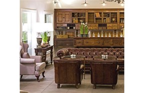 The lounge at the new 506 On the River Inn in Woodstock, Vt., is richly decorated with rustic Vermont antiques.