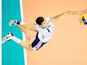 Matthew Anderson of USA serves the ball during the FIVB World Championships match between USA and Iran at Cracow Arena on September 2, 2014 in Cracow, Poland.