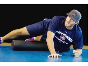 Montreal Canadiens Brandonn Prust stretches during team practice at the Brossard Sports complex in Montreal on Thursday September 18, 2014.