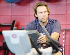 Montreal Canadiens David Desharnais rides a stationary bike during team practice at the Brossard Sports complex in Montreal on Thursday September 18, 2014.