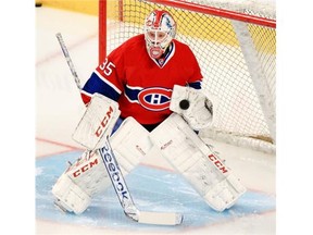 Montreal Canadiens goalie Dustin Tokarski stops puck during warm-up prior to Game 2 of their Eastern Conference final playoff series against the New York Rangers in Montreal Monday May 19, 2014. Tokarski was a surprise starter in place of the injured Carey Price.