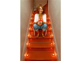 Tea lights light the staircase leading to artist Helga Schleeh's second story apartment in the Notre-Dame-de-Grace district of Montreal Tuesday September 02, 2014.