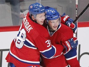Montreal Canadiens Nikita Scherbak, left, and Alex Galchenyuk celebrate Galchenyuks game-winning goal against the Colorado Avalanche in overtime of National Hockey League pre-season game in Montreal Thursday September 25, 2014.