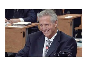 MONTREAL, QUE.: SEPTEMBER 5, 2014 --  Tony Accurso shares an unusual light moment with Jusice France Charbonneau during  Charbonneau Commission testimony Friday.  (Charbonneau Commission via The Gazette)