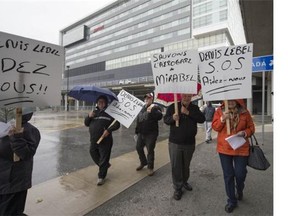 Protesters who want the Mirabel airport hangars saved march by the Marriott Hotel at Trudeau airport in Montreal on Saturday. One million square feet of buildings are supposed to be demolished at the former international airport north of in Montreal.